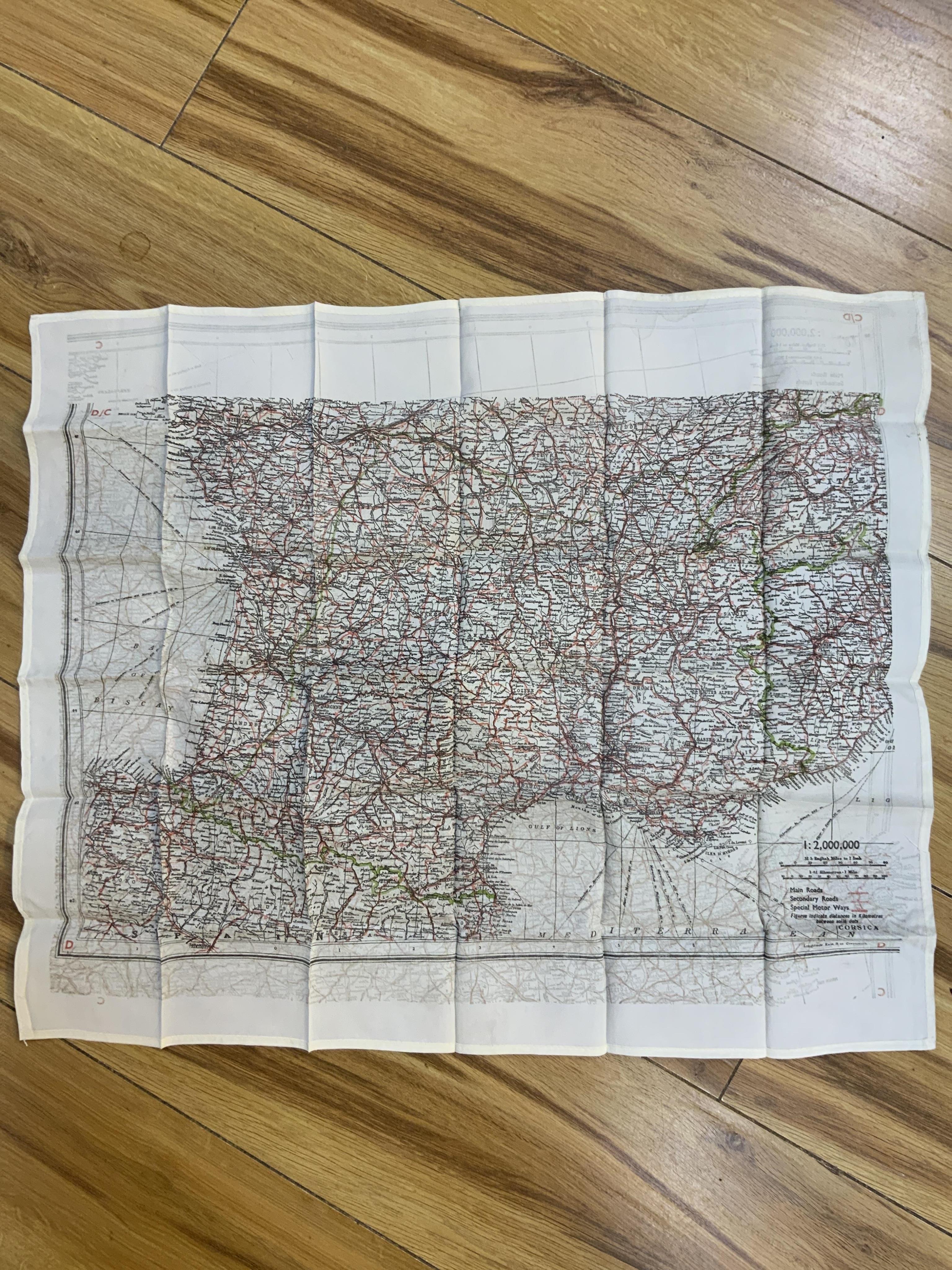 Four ‘escape’ style maps printed on silk type material, three printed double-sided; North Norway, 47x49cm, parts of Italy and Greece, 53x62cm, parts of France, 44x53cm, and a single sided map of part of the Mediterranean